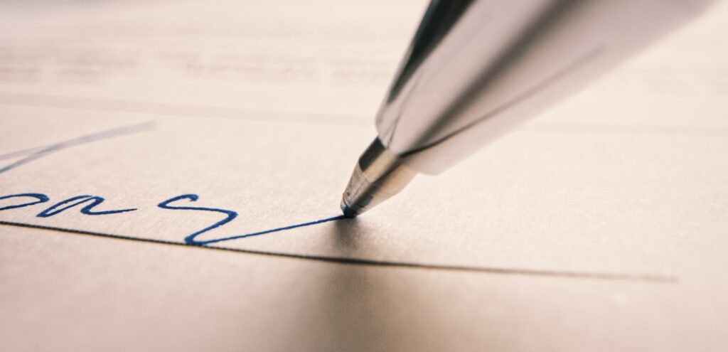 Person Signing Important Document. Camera Following Tip of the P Why Rental Property Often Stops Feeling Passive